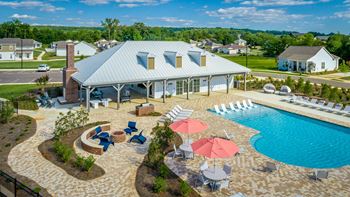 an aerial view of pavilion pool, entertainment, and social lounge resort style pool and sundeck  at Anthem Apartments and Luxury Rental Homes in Huntsville, AL